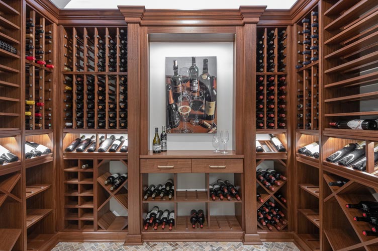 Walnut wine cellar with diverse bottle storage in Kessick's Towers Series, highlighting exclusive styles and personality.